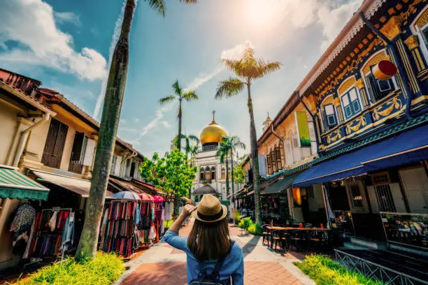 The Kampung Lorong Buangkok Mosque, the heart of the community in Kampong Lorong Buangkok, Singapore, featuring elegant architecture and a serene ambiance, with worshippers gathered for prayer, embodying the spiritual and cultural essence of the village.